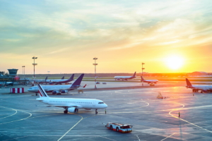 Airport with many airplanes at beautiful sunset - nvc concept