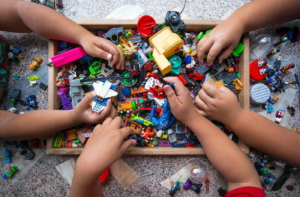 The hands of many children who are playing toys together - cspa concept