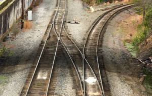 Railroad tracks diverging with a switch track.