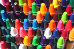 Multi-colored crayons in a box with lots of colors.