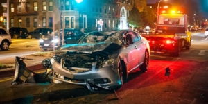 Car crash at night in the city, reckless driving concept.