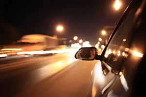 Blurred urban view of a car on the highway.