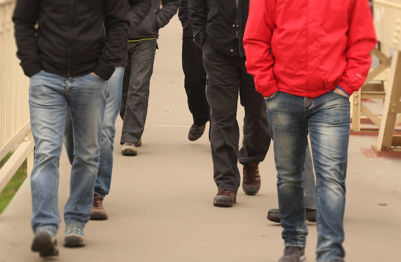 group of men walking, shot of their legs.