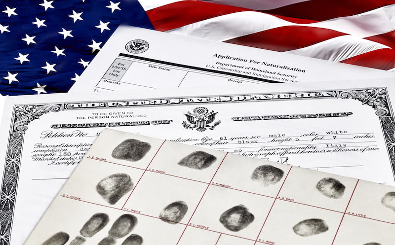 certificate of citizenship, fingerprint card and application for naturalization, isolated on white