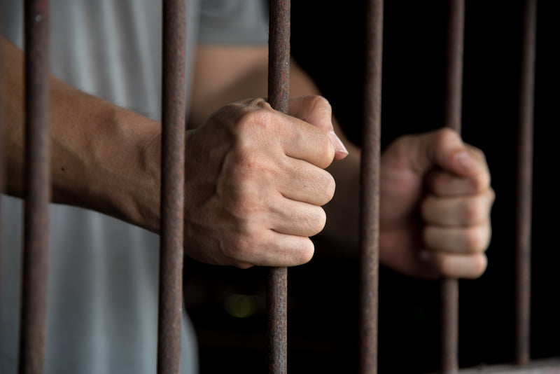 hands of the prisoner in jail