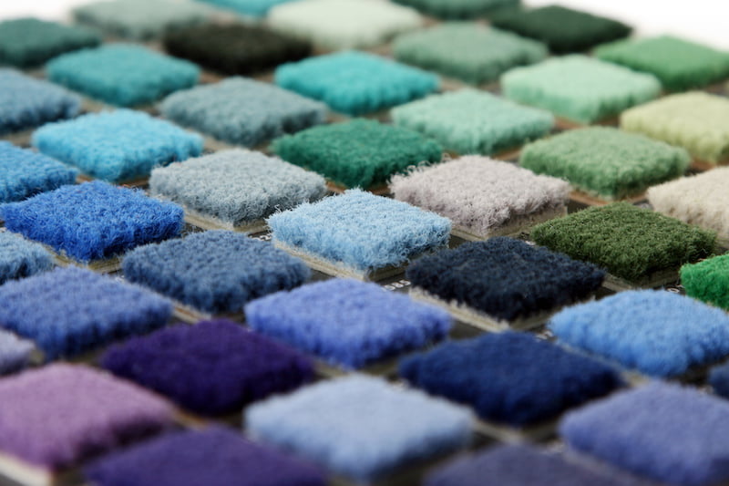 samples of color of a carpet covering closeup