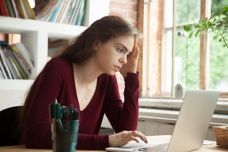 frustrated stressed woman feeling tired worried about work problem looking at laptop screen, businesswoman troubled with reading bad news online, email notification about debt or negative message