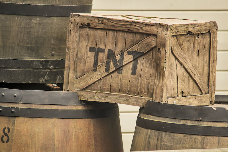 old fashioned tnt box on some barrels.
