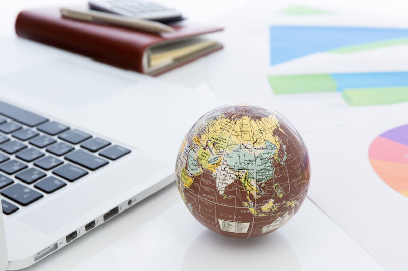 small globe with laptop.