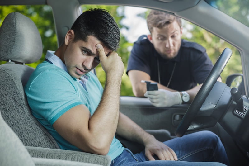 worried young driver caught on driving after alcohol