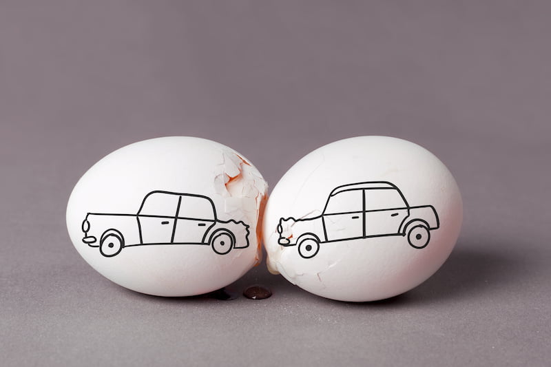 staring the car in case of an accident. the car drove into the back of another car. a broken egg is a symbol of trouble or breakdown.