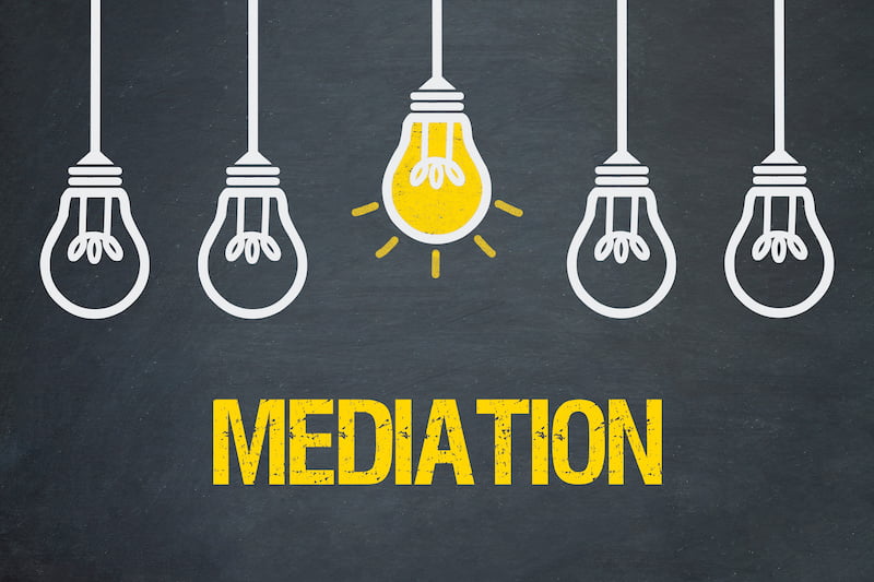 mediation concept - lightbulbs on grey background.