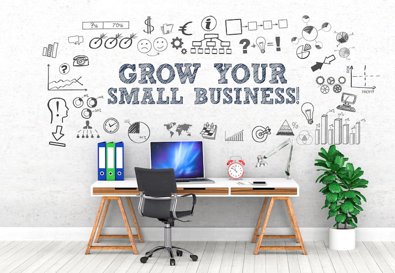 grow your small business with a small business license concept with a working desk and laptop.