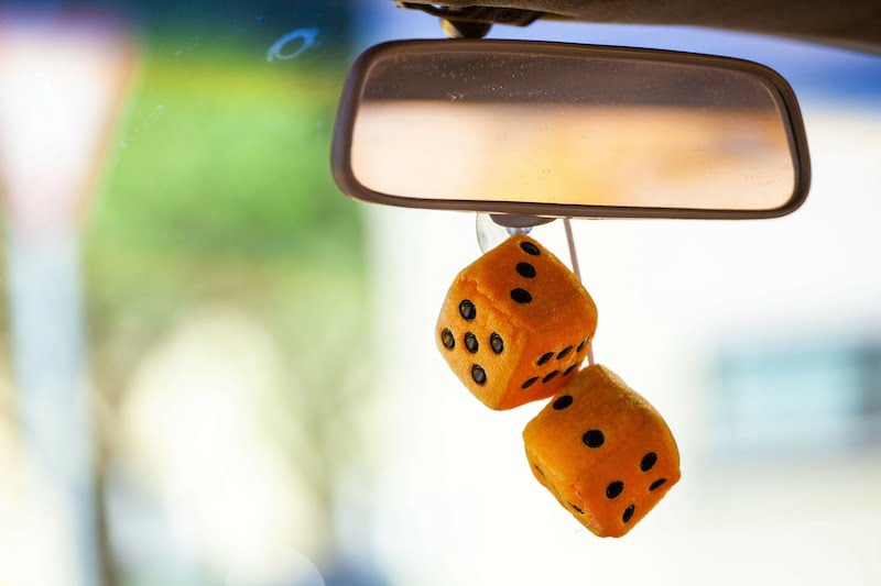 fuzzy dice hanging from the rear-view mirror.